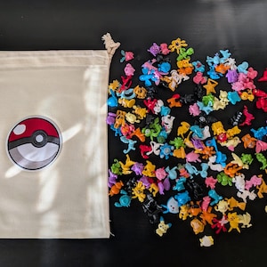 144 Count Pokemon Mini Figures with a Custom Embroidered Bag