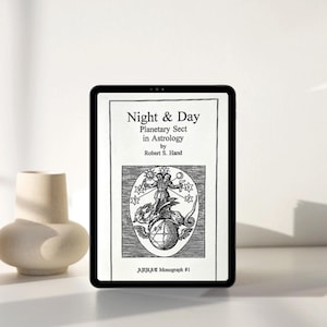 May include: A black tablet shows the cover of a book titled "Night & Day: Planetary Sect in Astrology" by Robert S. Hand. The cover has a black and white illustration of a figure on a globe, with stars. A cream-coloured vase is to the left.