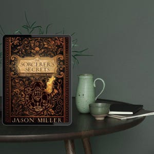 May include: A tablet displaying the book cover of "The Sorcerer's Secrets" by Jason Miller. The cover is ornate with gold and brown details. A green pitcher, a small cup, and a notebook sit on a dark wooden table.