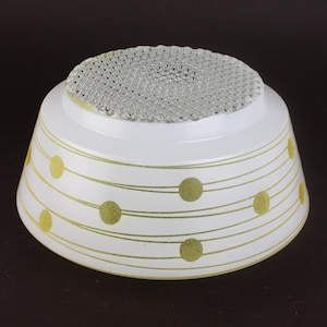 May include: White glass lampshade with gold horizontal lines and dots. The top has a textured, clear glass design. The lampshade is a vintage style, likely for a ceiling light fixture. The diameter is approximately 20 cm.