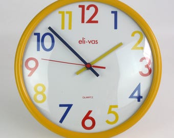Vintage Eli-vas-wandklok: Duitse kwarts uit de jaren 80, geel frame