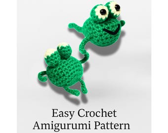 May include: A green crocheted frog plush with white accents, with the text "FLIP THE FROG". The image also includes the text "Easy Crochet Amigurumi Pattern" and "No-Sew • Tiny Frog Plush PDF".