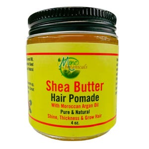 May include: A yellow jar of shea butter hair pomade with a black lid. The label reads "Shea Butter Hair Pomade with Moroccan Argan Oil Pure & Natural Shine, Thickness & Grow Hair 4 oz."