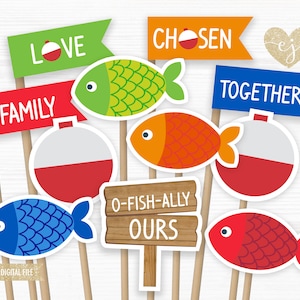 May include: Printable photo booth props with a fishing theme. The props include a red, white and blue bobber, a green fish, an orange fish, a blue fish, a red fish, and signs that say "Love", "Family", "Chosen", "Together", and "O-Fish-Ally Ours".