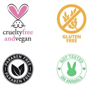 Puede incluir: Se muestran cuatro etiquetas de productos. Incluyen: "cruelty free and vegan" con un conejito rosa, "gluten free" con un s&iacute;mbolo de trigo tachado, "paraben free" en un dise&ntilde;o circular y "not tested on animals" con un conejito verde.