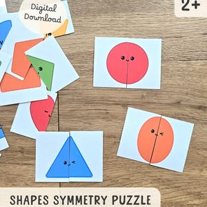 Könnte beinhalten: Eine Sammlung farbenfroher Formensymmetrie-Puzzles auf einer Holzoberfläche. Die Puzzles zeigen eine Vielzahl von Formen, darunter Kreise, Dreiecke und Ovale, die jeweils halbiert sind. Der Text "Shapes Symmetry Puzzle" ist sichtbar.