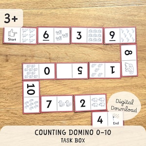 Könnte beinhalten: Ein Zähl-Domino-Set mit den Zahlen 0-10, mit Illustrationen von Tieren und Objekten. Die Dominosteine sind weiß mit einem rosa Rand und enthalten den Text "Start", "Ende" und "Digitaler Download". Das Set ist für Kinder ab 3 Jahren konzipiert.