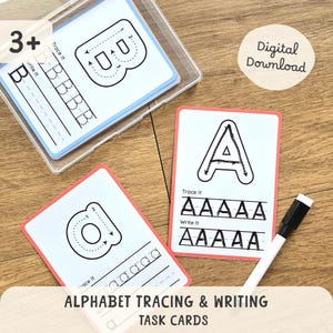 May include: Alphabet tracing and writing task cards with the letters A and B, featuring dotted lines for tracing and space to write. The cards have a pink border and are designed for children aged 3 and up. A dry-erase marker is included.