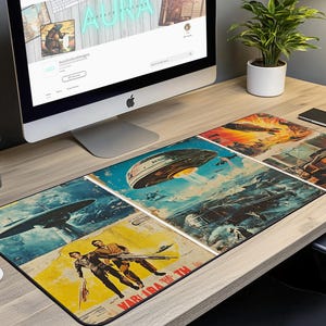 May include: A black and white mouse mat featuring a collage of vintage science fiction illustrations. The illustrations depict flying saucers, spaceships, and people in futuristic clothing. The text "WAR  IRA  THE" is visible in the bottom right corner.