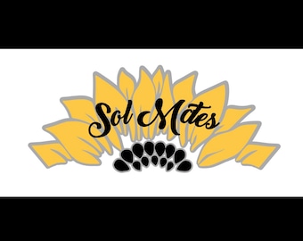 May include: A yellow sunflower with black seeds in the center. The word "Sol Mates" is written in black cursive script in the center of the sunflower.