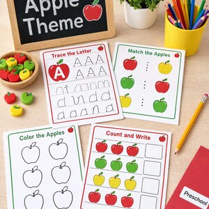 Op de afbeelding: Een educatieve activiteitenset met vier witte werkbladen met appel-thema opdrachten getiteld Trace the Letter, Match the Apples, Color the Apples en Count and Write, samen met een klein schoolbord, kleurpotloden en appelvormige fiches.