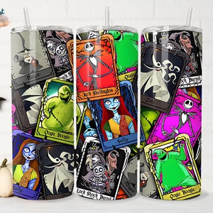 May include: A set of three stainless steel tumblers featuring a colourful design with characters from The Nightmare Before Christmas. The tumblers are covered in a collage of images of Jack Skellington, Sally, Oogie Boogie, and other characters from the film. The tumblers are all different colours and have a variety of different designs.