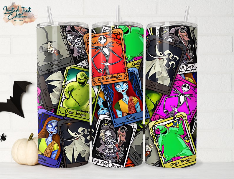 May include: A set of three stainless steel tumblers featuring a colourful design with characters from The Nightmare Before Christmas. The tumblers are covered in a collage of images of Jack Skellington, Sally, Oogie Boogie, and other characters from the film. The tumblers are all different colours and have a variety of different designs.