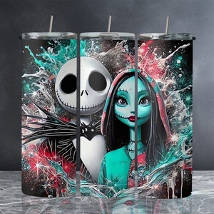 May include: A set of three stainless steel tumblers with a colorful abstract design featuring Jack Skellington and Sally from the Nightmare Before Christmas. The tumblers have a black background with splashes of red, blue, and green paint.
