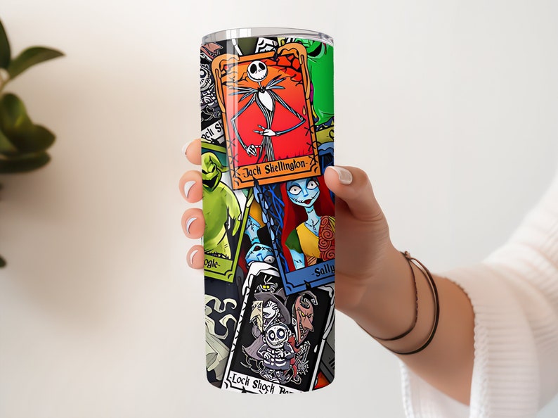 May include: A stainless steel tumbler featuring a colourful collage of characters from The Nightmare Before Christmas. The characters include Jack Skellington, Sally, Oogie Boogie, and Lock, Shock, and Barrel. The tumbler is a great way to show your love for the film.