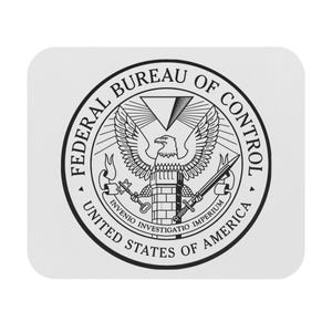 May include: A white square coaster featuring the Federal Bureau of Control seal. The black and white seal includes an eagle, keys, a sword, and the text "Federal Bureau of Control" and "United States of America."