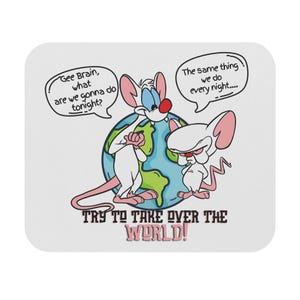 May include: White mouse pad featuring Pinky and the Brain cartoon characters. Pinky asks Brain "Gee Brain, what are we gonna do tonight?" Brain replies "The same thing we do every night..." with the text "TRY TO TAKE OVER THE WORLD!"