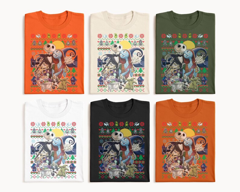 May include: Six different color t-shirts featuring a Christmas-themed design with Jack Skellington and Sally from The Nightmare Before Christmas. The design includes a moon, stars, and a Christmas tree.