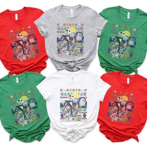 May include: Six different color t-shirts featuring a Christmas-themed graphic of Jack Skellington and Sally from the Nightmare Before Christmas movie. The shirts are all short-sleeved and crew neck.