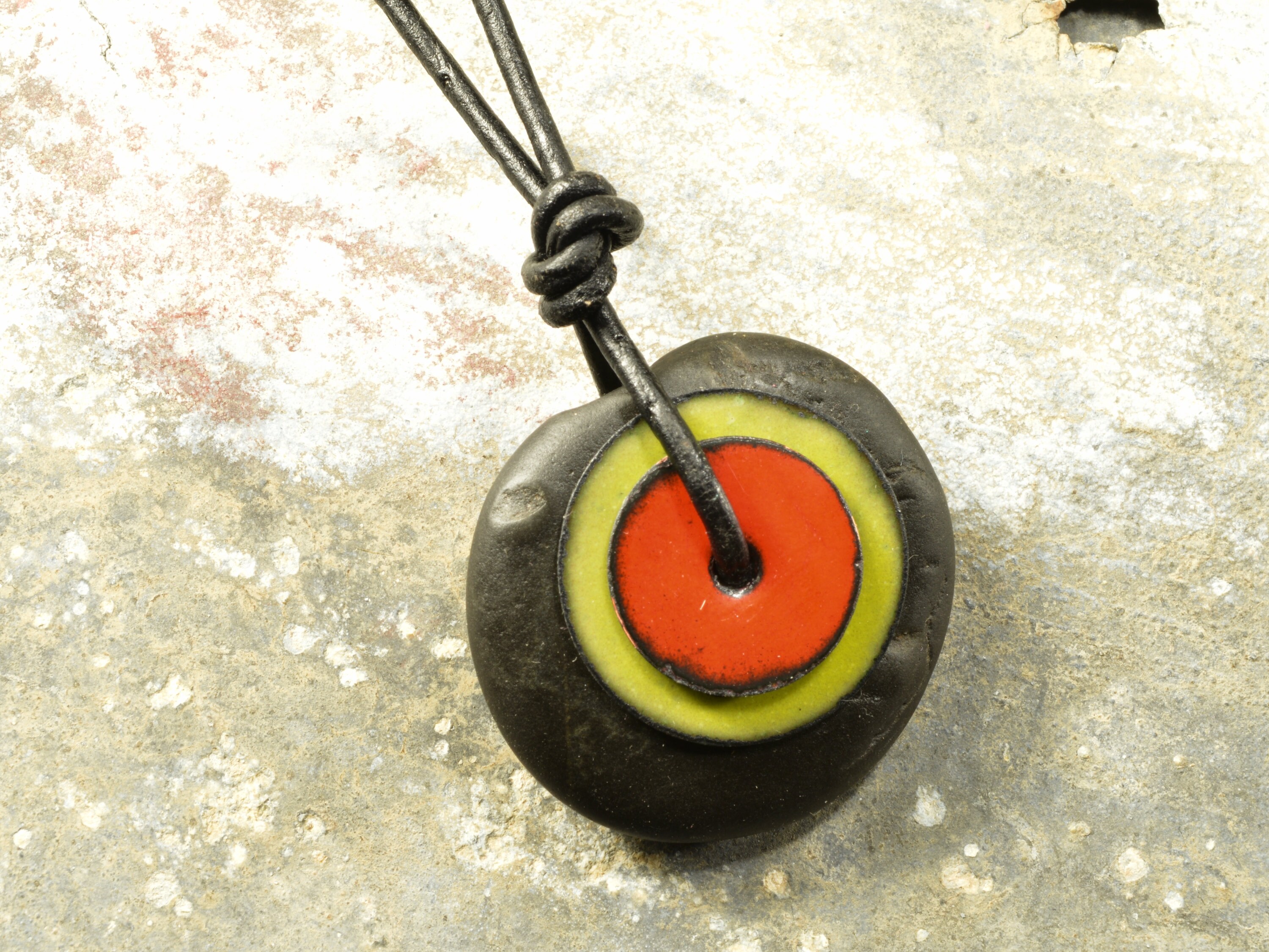 Wow   a flat jet black stone and enamel Maine sea worry stone necklace on an adjustable black leather cord with  glass African trade beads