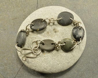 Dark beauty   a genuine Maine sea stone bracelet with hand forged German silver links and clasp