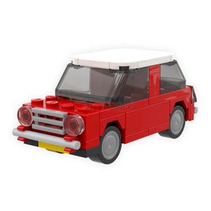 Op de afbeelding: Een rode speelgoedauto met een wit dak. De auto heeft zwarte wielen en een zilveren grille.