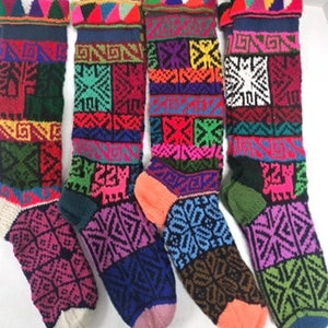 May include: Five pairs of colorful knitted socks with geometric patterns. The socks are made of wool and have a variety of colors, including red, blue, green, yellow, and purple.