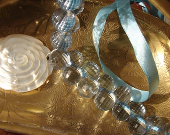 Light Blue ribbon and bead choker with mother of pearl carved flower