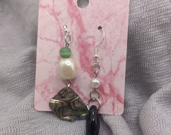 Mismatched Mermaid tail earrings featuring hand blown glass