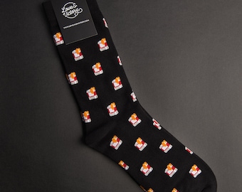 May include: Black socks with a repeating pattern of red and yellow takeout boxes. The socks have a tag attached that says "Love & Victory" and "www.loveandvictory.com".
