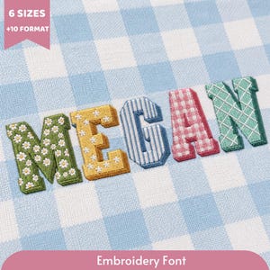 May include: The name MEGAN is displayed in embroidered block letters on a light blue and white gingham fabric. Each letter features a unique pattern: green with white daisies, yellow with white stars, blue stripes, pink gingham, and mint green grid.