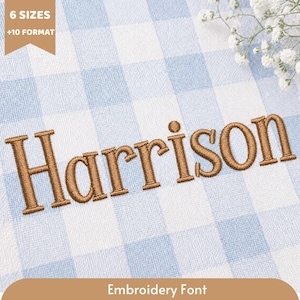 May include: The name Harrison is embroidered in brown thread on a light blue and white gingham fabric. A tan banner in the top left corner displays the text 6 SIZES +10 FORMAT, and a tan banner at the bottom displays the text Embroidery Font.
