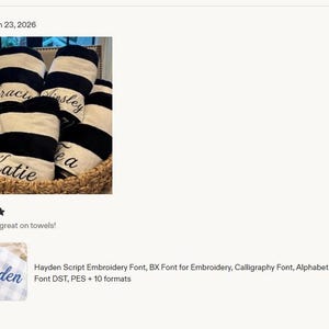 May include: A collection of folded towels featuring thick black and white horizontal stripes. Each towel is personalized with embroidered names in a cursive script font, including the names Gracie, Ainsley, Katie, and Lea, all arranged in a basket.