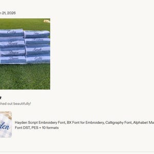 May include: A stack of blue and white striped towels, each embroidered with a different name in a cursive script font. A separate close-up shows the name Hayden stitched in blue thread on a light blue and white checkered fabric background.