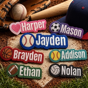 May include: Six rectangular embroidered patches featuring names and sports icons. The patches display the names Harper, Mason, Jayden, Brayden, Addison, Ethan, and Nolan alongside a pink heart, soccer ball, baseball, basketball, softball, football, and volleyball.