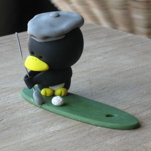 golfer penguin