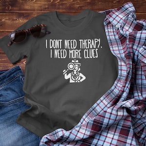 Funny True Crime T-Shirt: I Need More Clues, Mystery Lover Gift