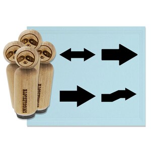 May include: Wooden stamps with sloth faces and the text "SNIGGLESLOTH" next to black arrow designs on a light blue background. The arrows point in various directions, including left, right, and bidirectional.