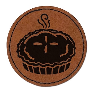 May include: A brown leather coaster with a black silhouette of a pie with a single crust. The pie has a steam coming from it.