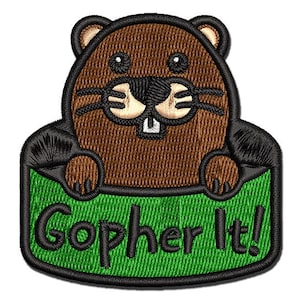 May include: Embroidered patch featuring a cartoon gopher with brown fur, black eyes, and a white nose, peeking out of a green hole with the text "Gopher It!" in black.