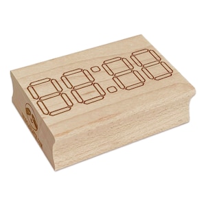 May include: A rectangular wooden stamp with the numbers "88:88" etched on the top. The numbers are in a digital clock style. The stamp has a light wood grain and a logo on the side.