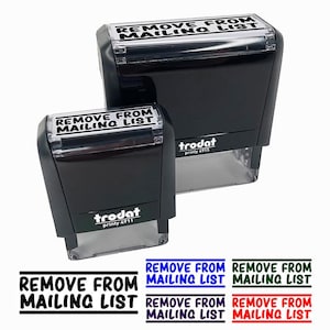 May include: Two black "Remove From Mailing List" stamps with the text in white. The stamps are different sizes and have the brand name "trodat" printed on them. Below the stamps are six text examples in black, blue, green, and red.