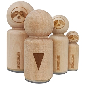 May include: A collection of wooden stamps featuring a sloth design. The stamps vary in size and have a natural wood finish. One stamp has a brown triangle. The text "SNIGGLESLOTH" is printed on the side of some stamps.