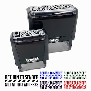 May include: Two black "Return to Sender" stamps with the text "Not at this Address". The stamps are different sizes and have a clear base. Below are examples of the stamp in black, blue, green, and red.