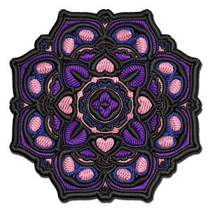 May include: A purple and pink mandala design with intricate details. The mandala is embroidered with a black outline and has a circular shape.