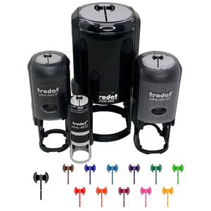 May include: Four black Trodat Printy self-inking stamps in sizes 4612, 4619, 4642, and 4625, each featuring a double-headed axe icon on the top. Below the stamps are twelve small, colorful axe icons in black, brown, blue, light blue, purple, green, lime, red, orange, magenta, pink, and yellow.