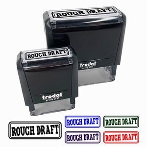 May include: Two black "ROUGH DRAFT" stamps of different sizes, with the text in a white rectangle. The stamps are from the brand "trodat". Below are four rectangular stamps with the text "ROUGH DRAFT" in different colors.