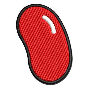May include: A red, bean-shaped embroidered patch with a thick black border. The patch features a small, curved white highlight in the upper right section, giving it a glossy appearance. The texture of the embroidery is visible throughout the surface.