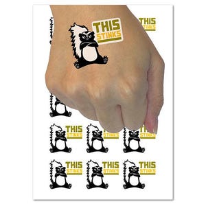 This Stinks Says the Grumpy Skunk Temporary Tattoo Water Resistant Fake Body Art Set Collection (1 Sheet)