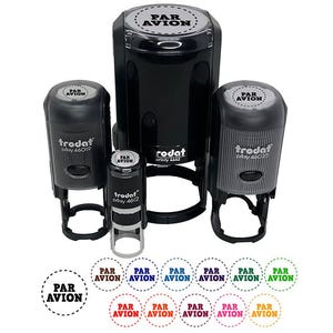 May include: A collection of black self-inking stamps with the text "PAR AVION" in a circular design. The stamps are of various sizes and the text is also shown in multiple colors.
